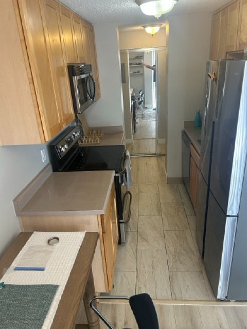 Kitchen with new appliances & ample storage (stocked with nice dishes & cookware).