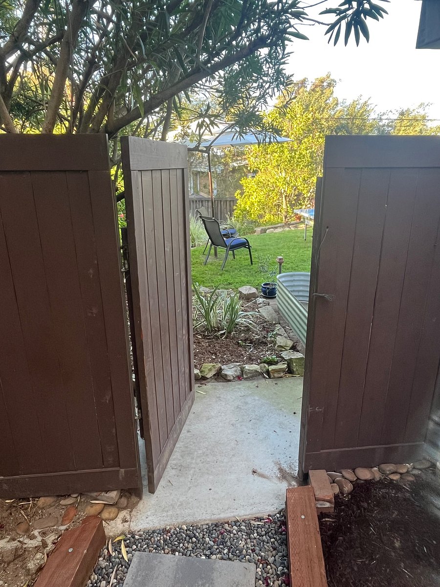 Private entrance to back yard leading to private entrance to home