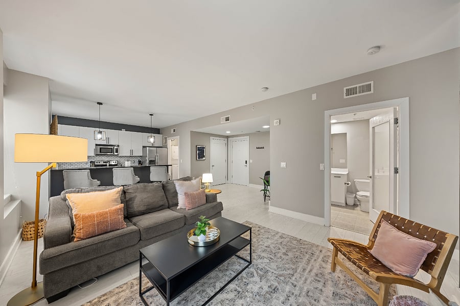 Living room and full bathroom entrance.