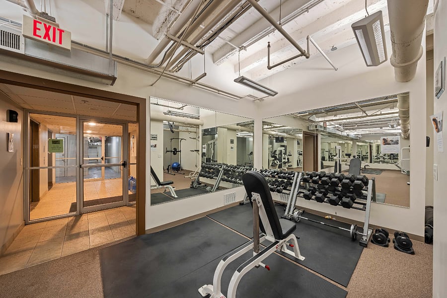 Full workout gym with a sauna located in the basement of the building.