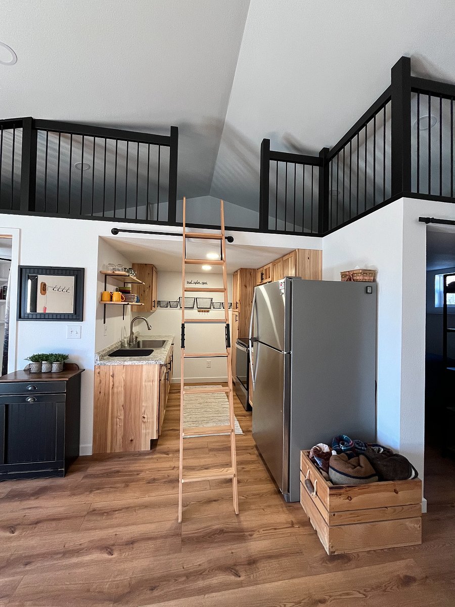 Kitchenette - full refrigerator, range, microwave; baskets for produce; furnished well with kitchen needs + more!
Ladder access to short loft; ladder can be stored to the side when not needed