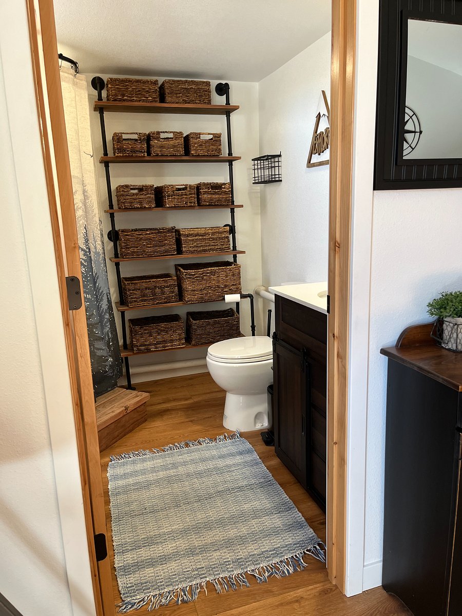 Bathroom -- plenty of baskets for bathroom linens and personal items