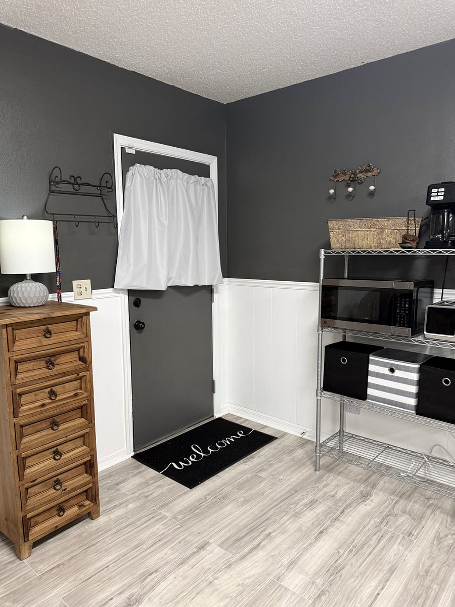 Inviting front door entryway with a dresser, plus a designated spot to keep your keys and daily essentials organized
