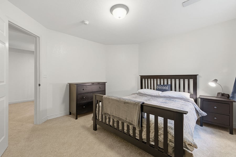 Private bedroom with comfortable bed and closet space