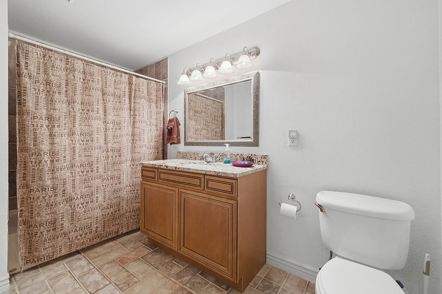Private bathroom with tub and shower