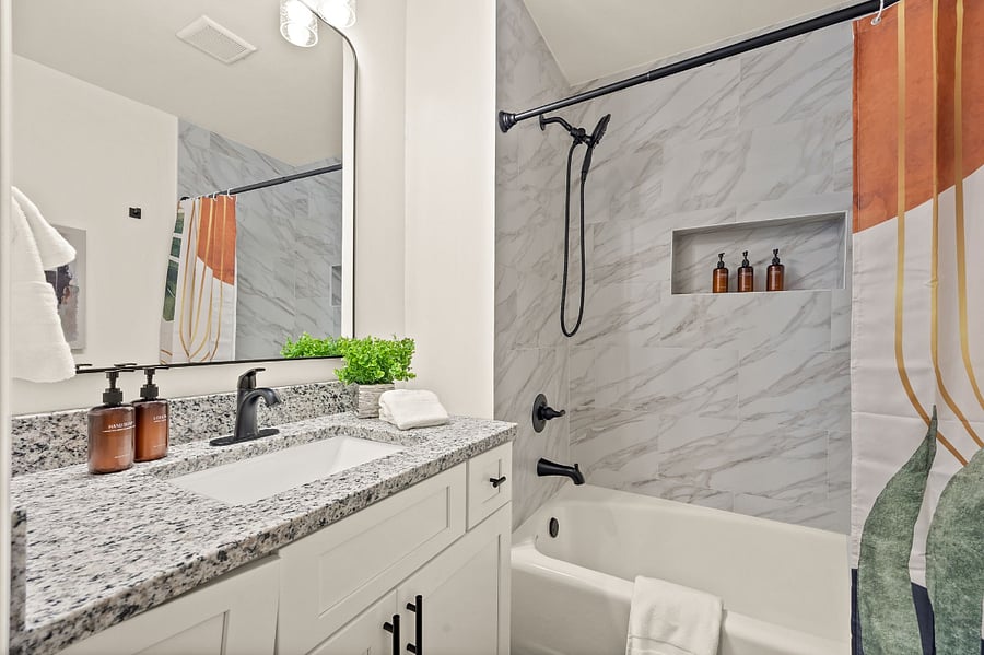 Ensuite Master bathroom with tub/shower combo.