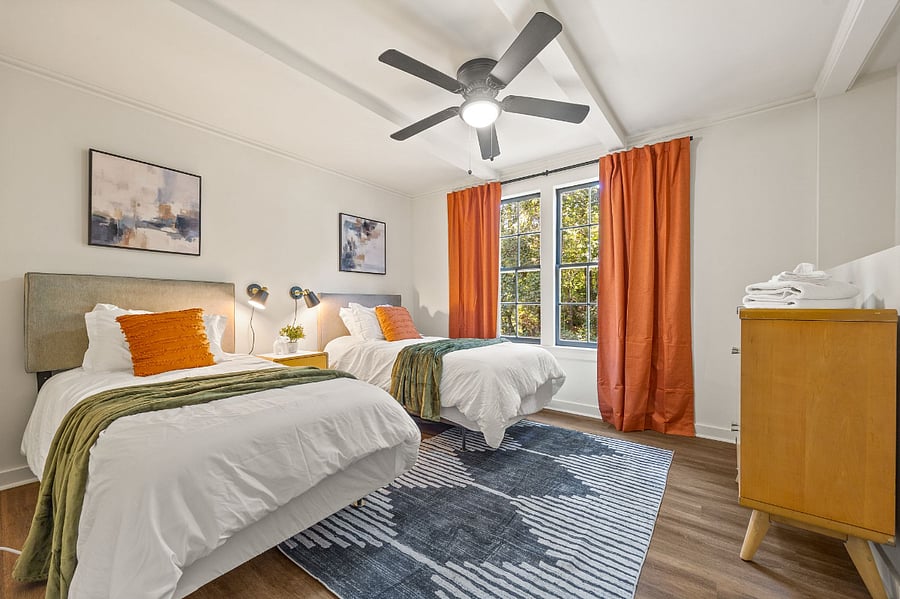 Bedroom with 2 twin beds, dresser and closet.