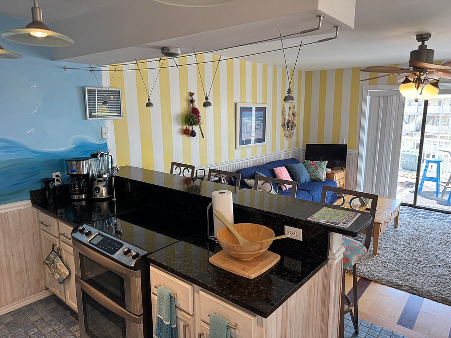 View From Kitchen with Seating At Bar