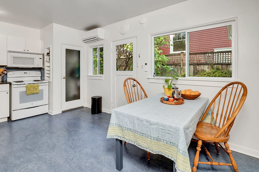 Sunny eat in kitchen opens to side yard