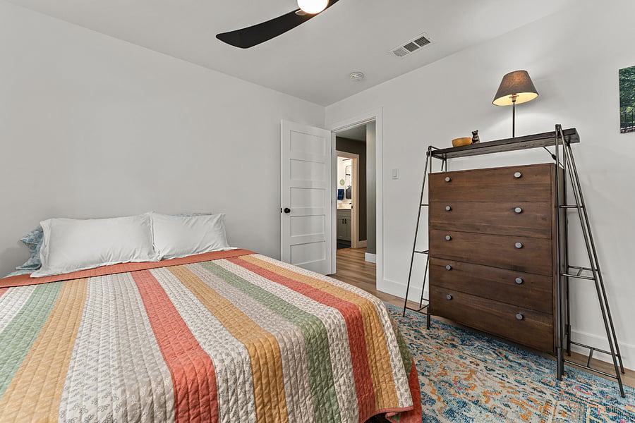 The secondary bedroom has a queen memory foam mattress and wall-to-wall closets!