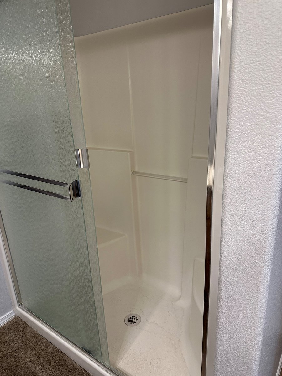 Standing shower in primary bath with double built in seating