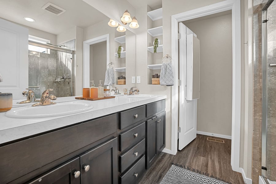 Bright south-facing master suite bathroom featuring a widow with natural light