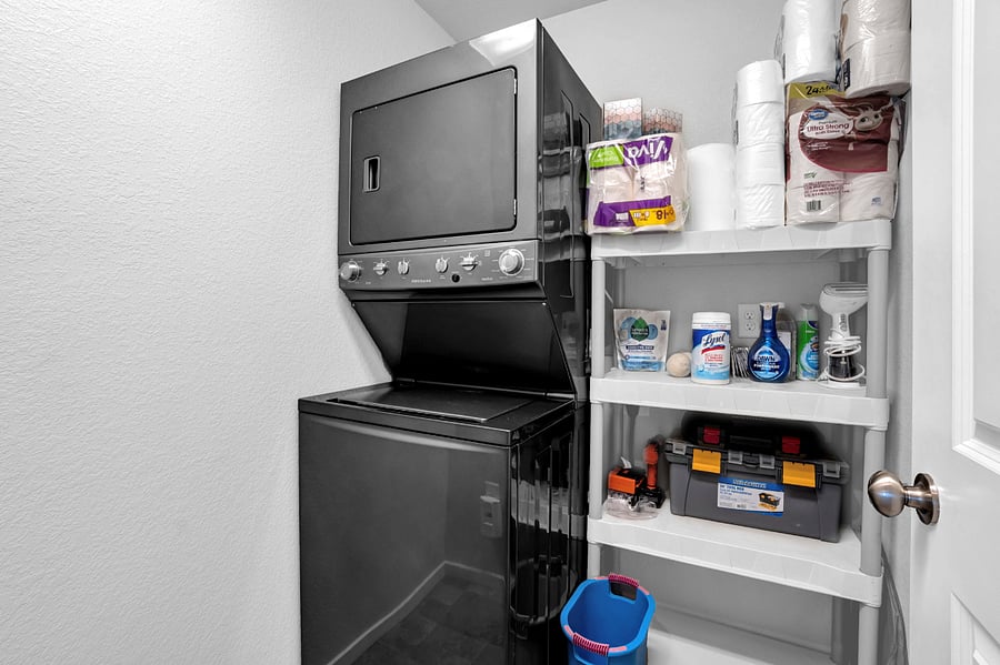 In-unit washer/dryer in dedicated laundry room with closing door