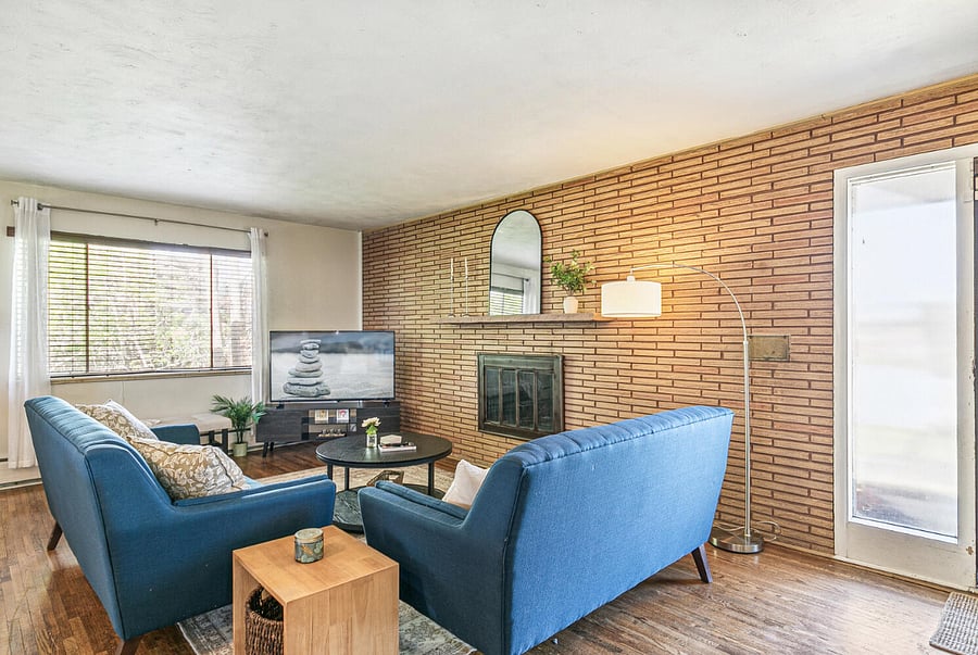 Main Level Living Room: Open layout with fireplace & smart TV