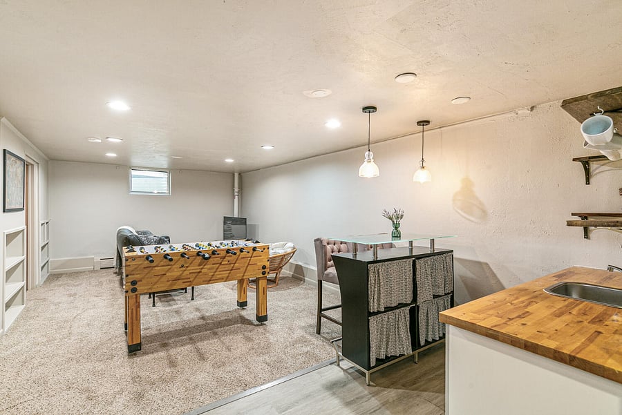 Second living area with wet bar & foosball