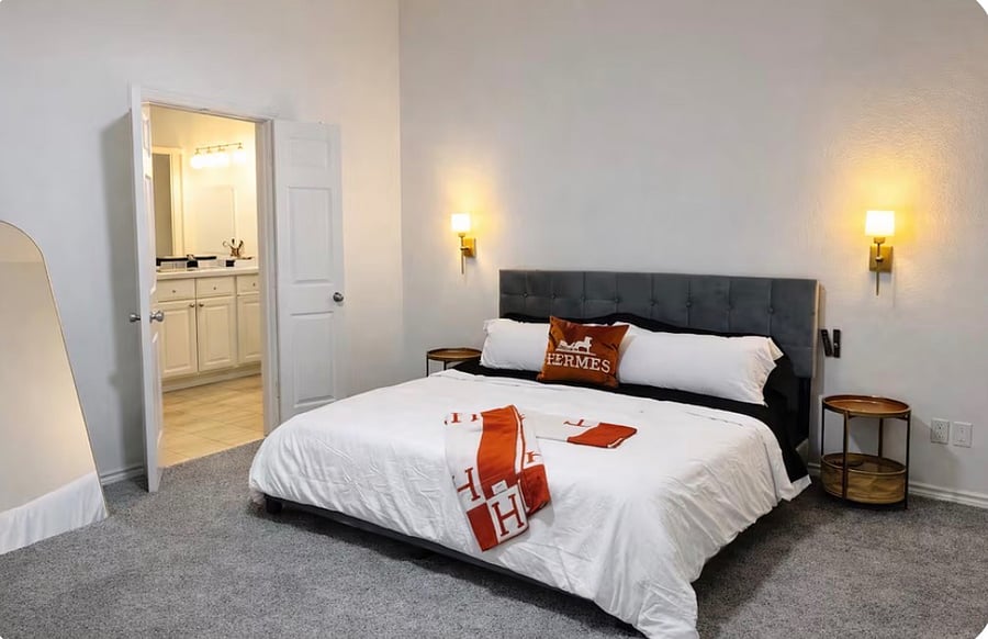 Spacious main room featuring a king-size bed and a TV for relaxing after a long day. Designed for comfort with plenty of space to unwind.