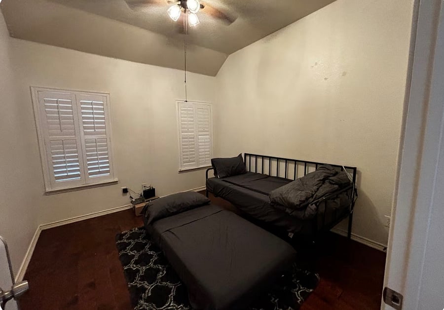 Third bedroom featuring two twin beds, ideal for kids, friends, or additional guests.