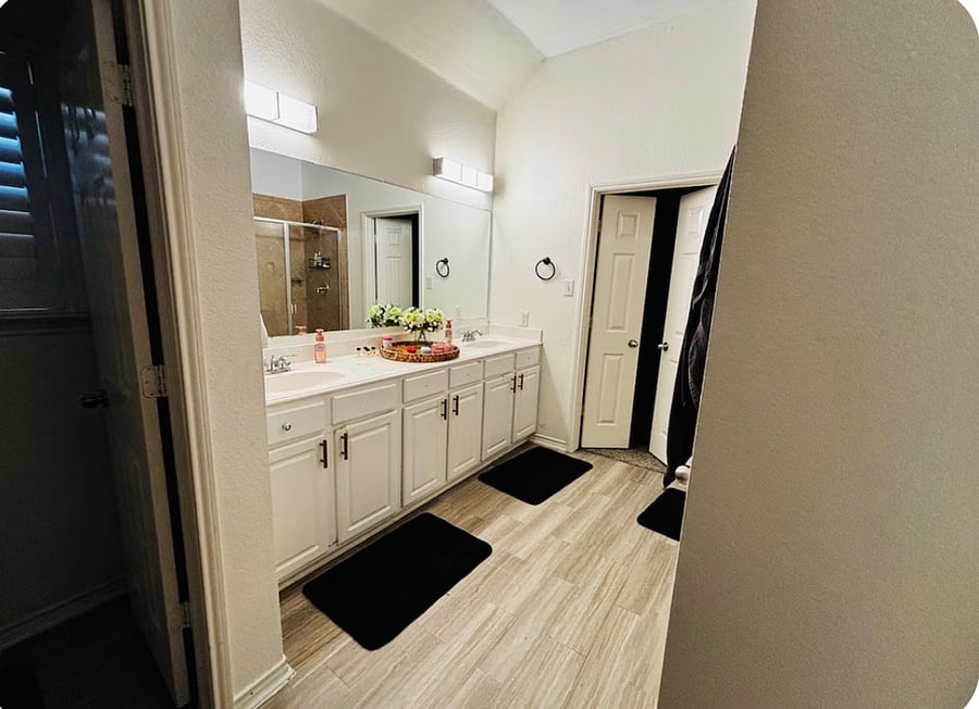 The main bathroom features a spacious double vanity with ample counter space, perfect for getting ready comfortably. Bright, clean, and thoughtfully designed for everyday convenience.