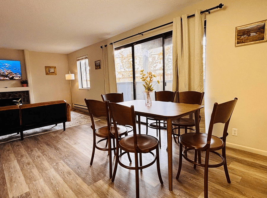 cozy dinning area with large patio window