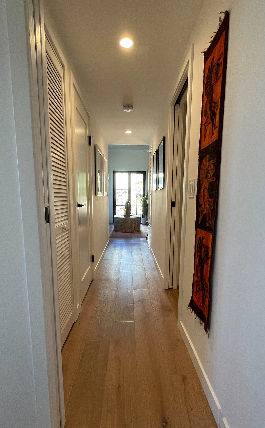 Hallway has stackable washer/dryer closet.