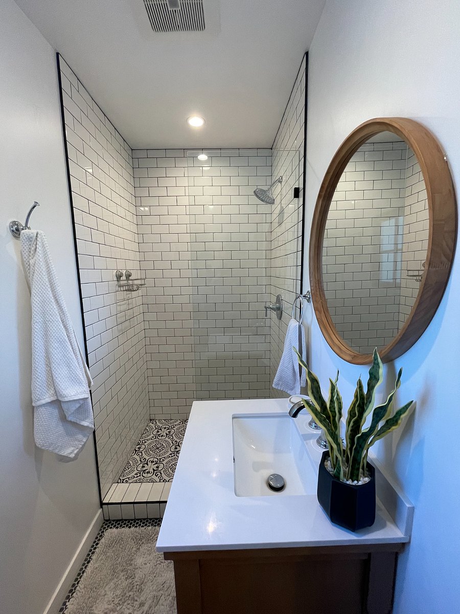 Bathroom has standing shower.