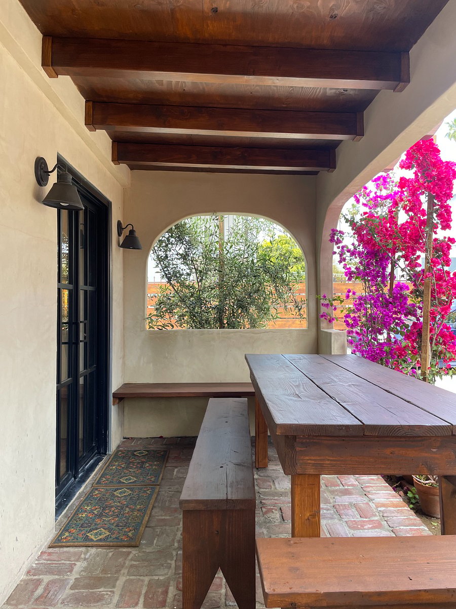 Front porch has large table.
