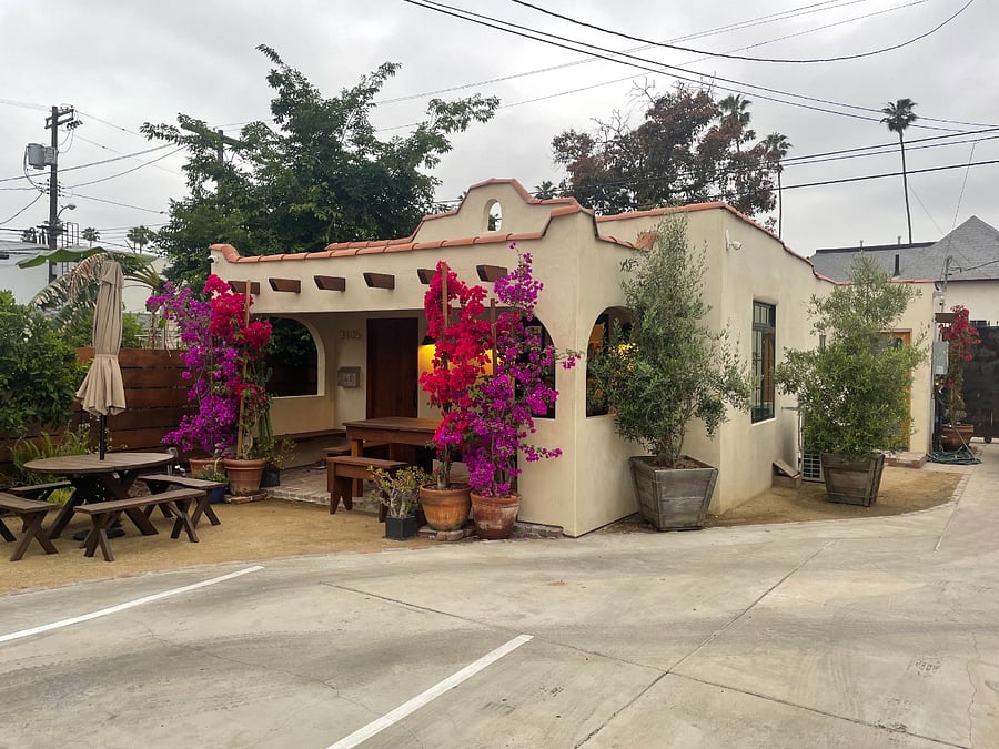 Unit sits quietly in the back of the gated property; parking area and driveway.