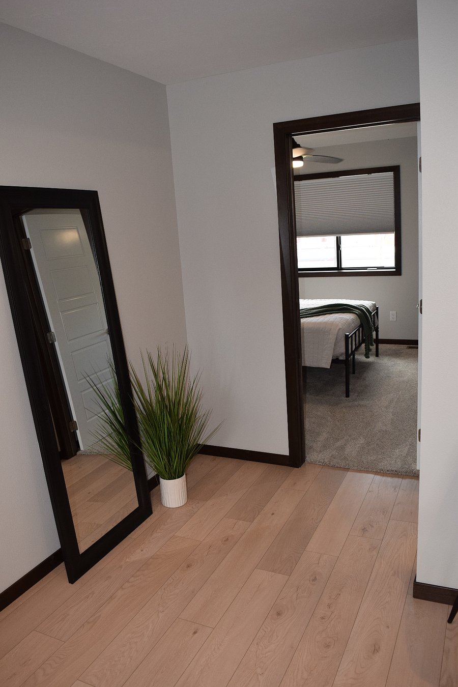 Bedroom 1 with queen bed and walk-in closet.