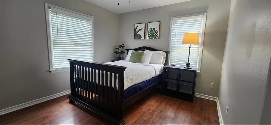 In this cozy bedroom, there's a full sized bed. Included in this space is a private closet for clothing storage. this room is located at the end of the hall and to the left.
