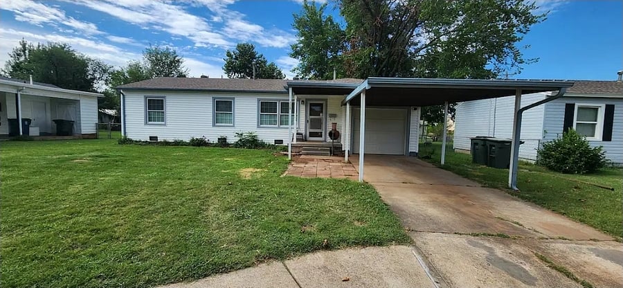 Here's the street view of the home and yes, there is a carport for additional protective parking.