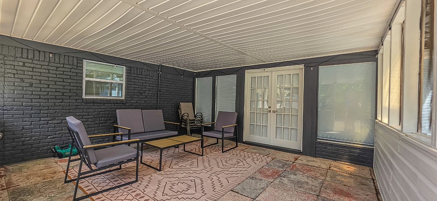 The screened-in porch is one of the shared common areas.