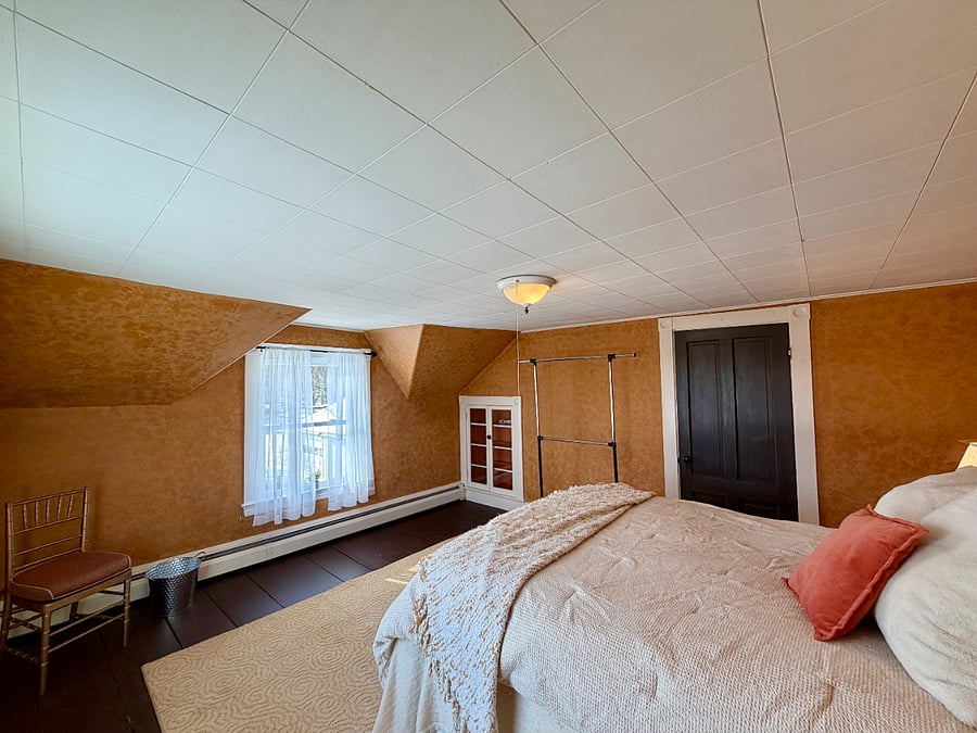 Bedroom 1: Queen Sized bed, built in shelving and external rack for hanging clothing