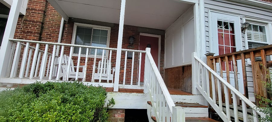 Front porch with Adirondack chairs.