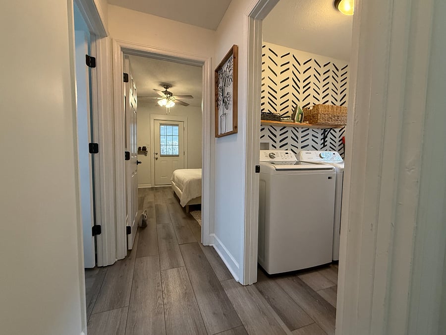 full-sized washer and dryer in laundry room