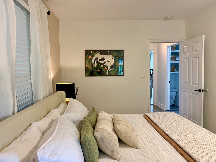 primary bedroom with king bed and attached bath