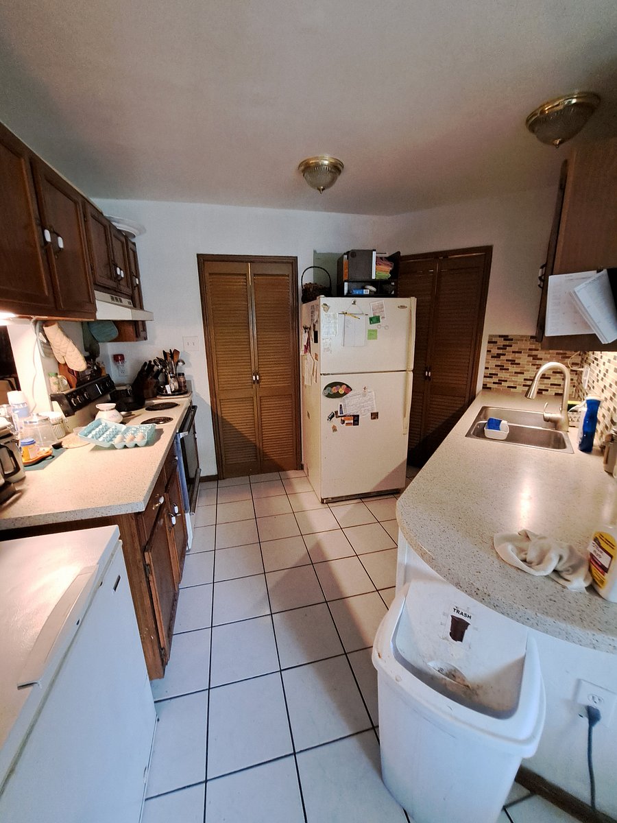 Fully equipped shared kitchen and laundry are (left side of fridge)