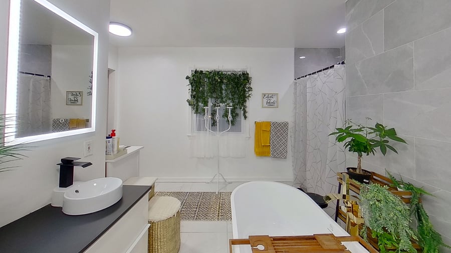 Bathroom has two sinks with LED lighting. 

