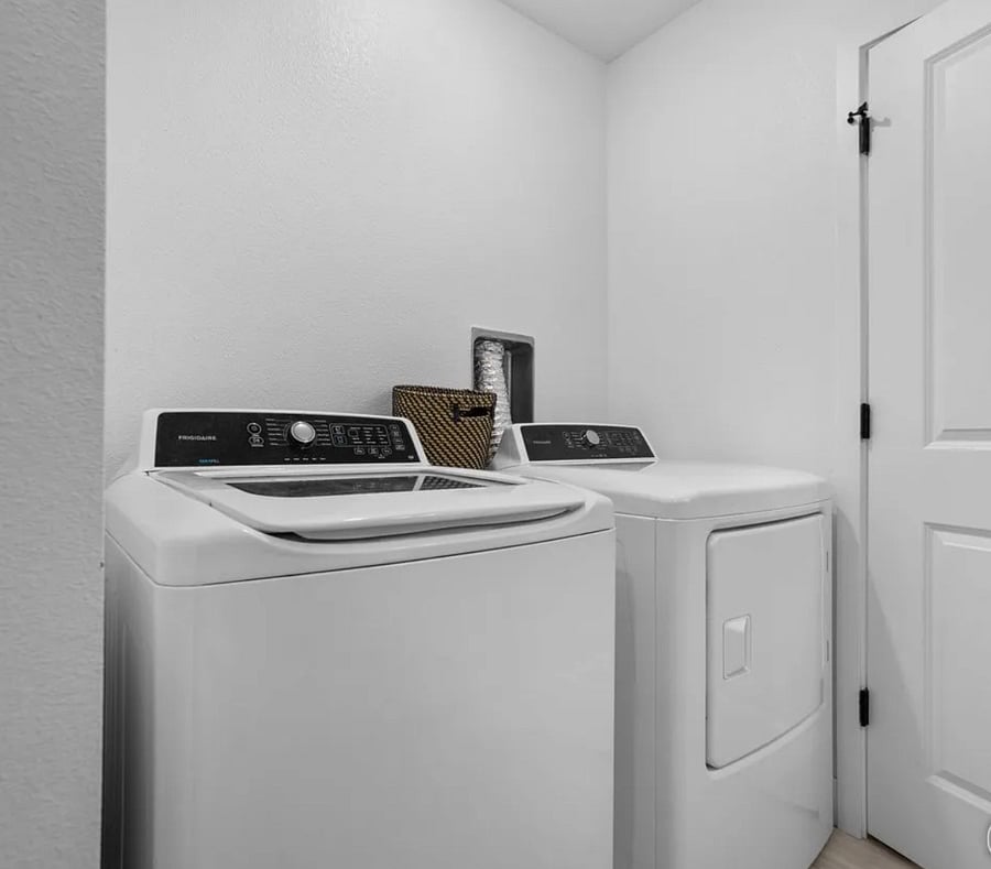 Washer and Dryer inside upstairs bathroom.