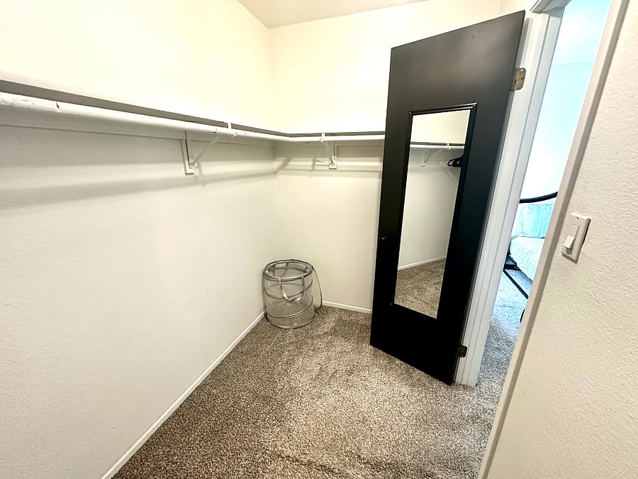 Master bed walk in closet POV 2