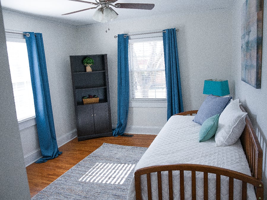 Flexible bedroom/office space with monitor and desk
