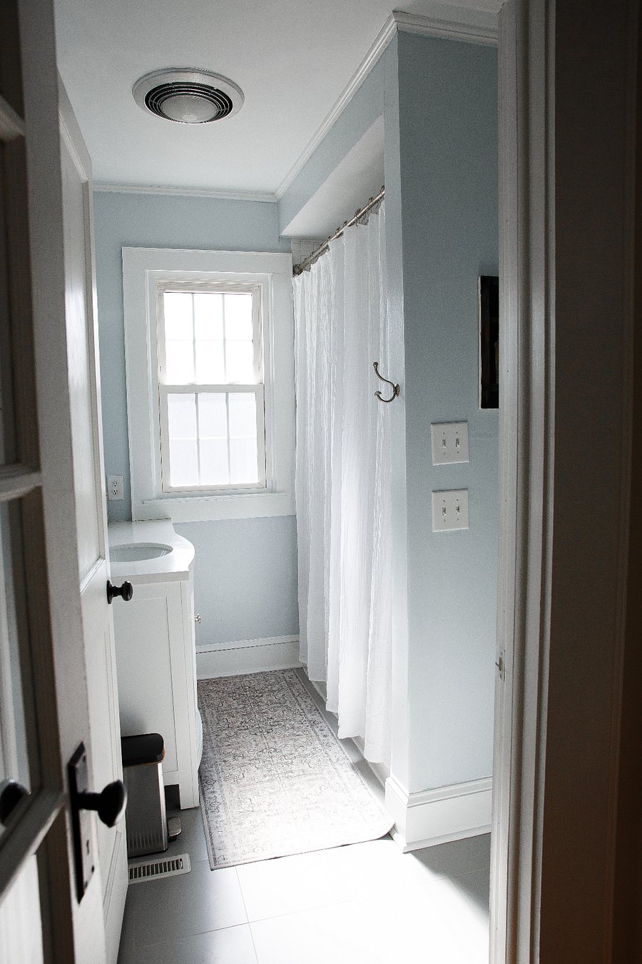 Main bathroom with vanity, shower, and tub.
