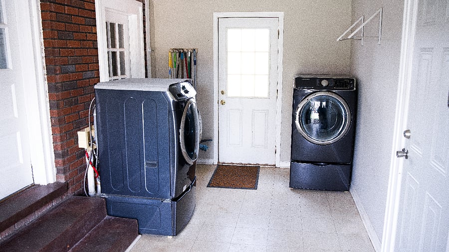 Washer/Dryer and "Mudroom" with large coat rack and service rack leading to the sizeable and lighted deck. 