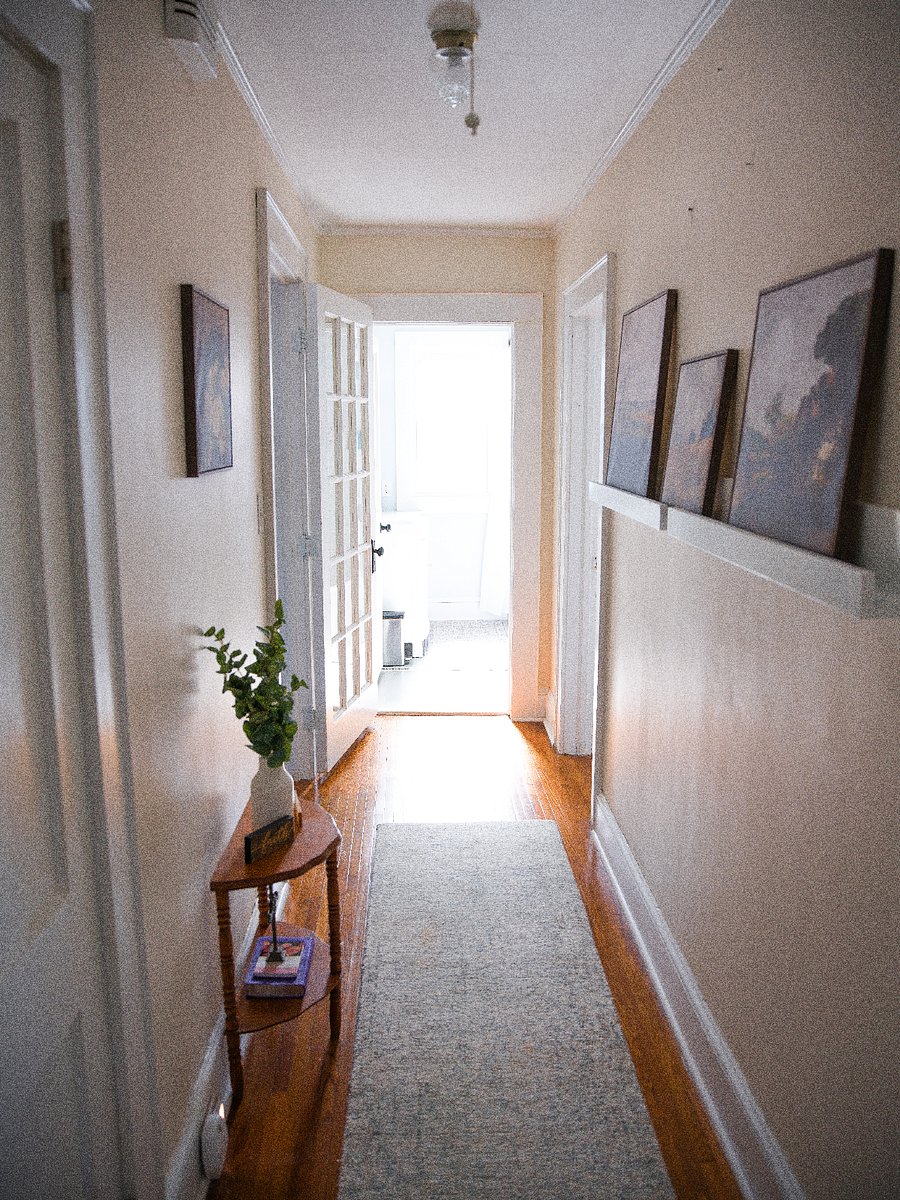 Door between living room and bedrooms for better sound control.