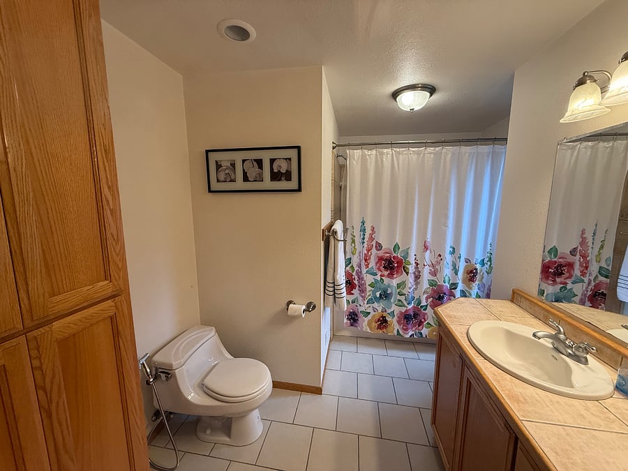 Full bath with generous storage.