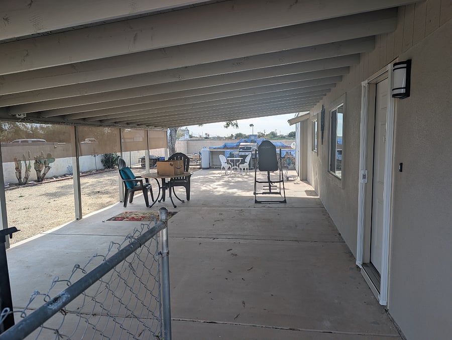 Huge front porch with block wall the entire property