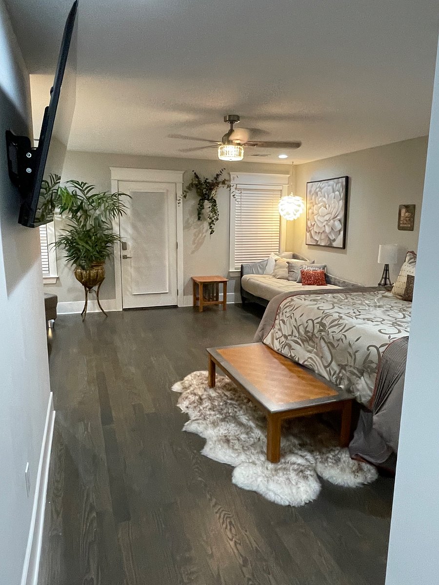 Master suite bedroom with walk out balcony, king bed and two twins for small children.