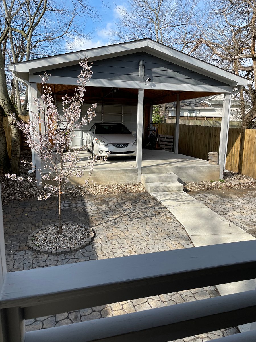Open garage, great for outdoor entertaining. Behind the garage is private drive which accommodates 2 cars. Alley access.