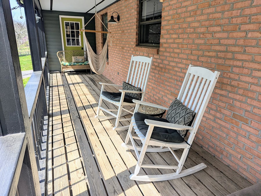 Covered back deck with rocking chairs and chair swing