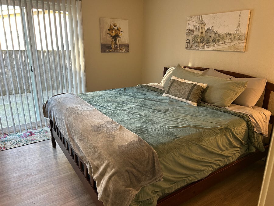 Primary bedroom King sized bed
