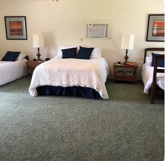 Upstairs bedroom with Queen bed and two bunk beds.